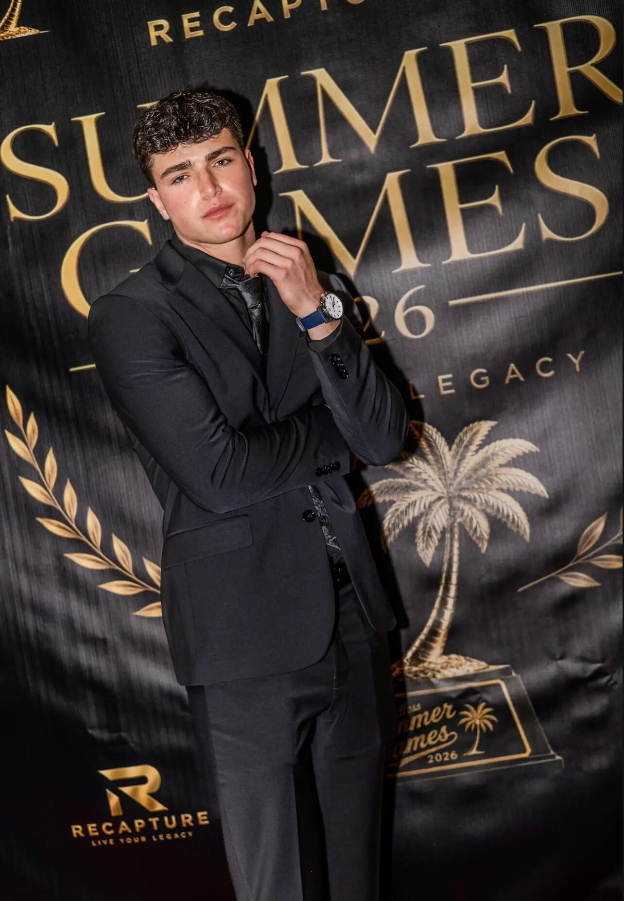 Jaxon Avery portrait in a black suit